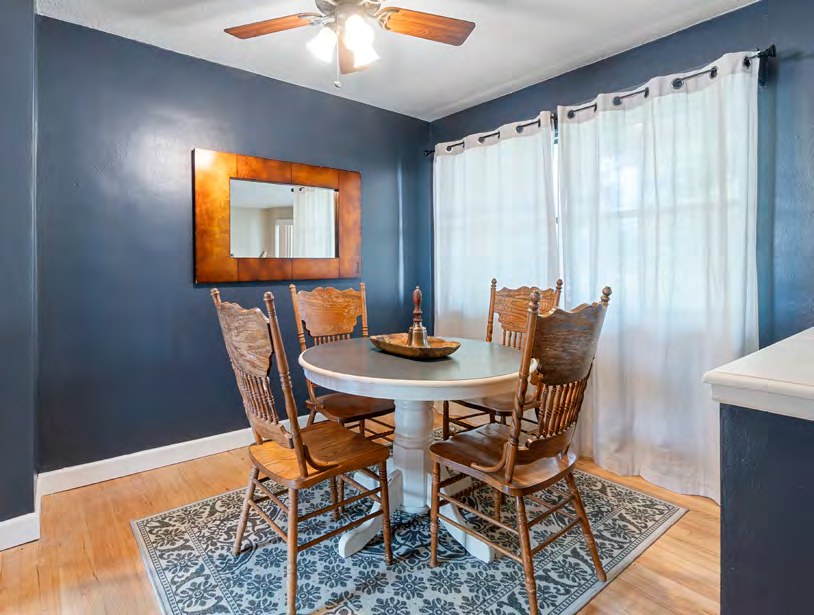Interior view of a dining area with a round table and chairs