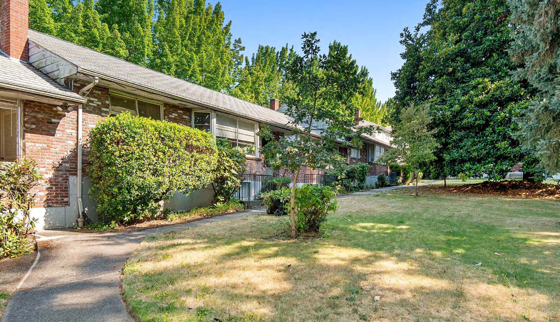 Exterior view of the apartment building and lawn
